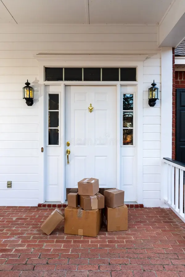 Packages left at the front door of an unoccupied home